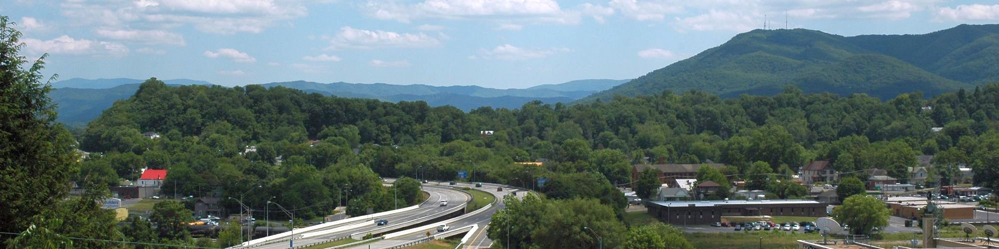 Interstate 26 wraps through downtown Johnson City with Buffalo Mountain in the background
