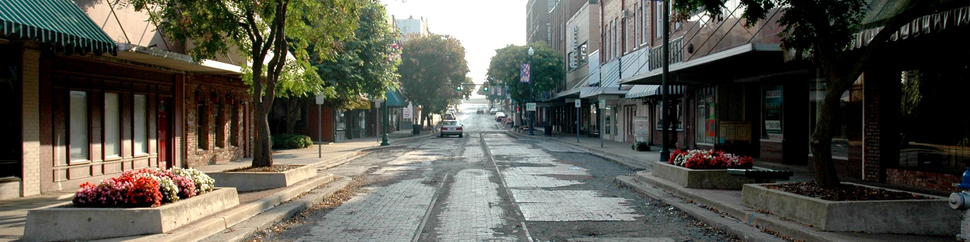 Main Street in downtown Johnson City with bricks and tracks revealed after pavement removed